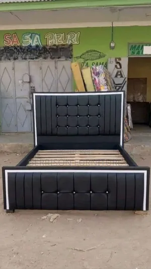 Executive Black Tufted Upholstered Bed Frame With White Border
