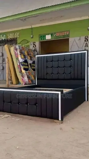 Executive Black Tufted Upholstered Bed Frame With White Border