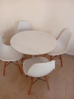 White Marble Top Table With 4 Eames Style Chairs