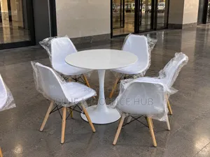 White Round Dining Table Set With 4 Eames Chairs