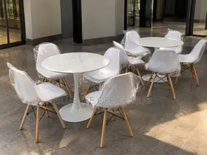 White Round Dining Table Set With 4 Eames Chairs