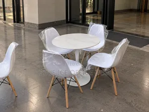 White Round Dining Table Set With 4 Eames Chairs