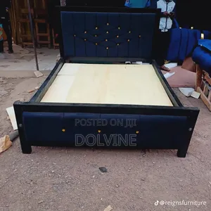 Elegant Navy Blue Upholstered Bed Frame With Gold Button Details