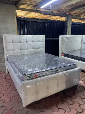 An All White Queen Size Modern Bed Design With Orthopedicmatress