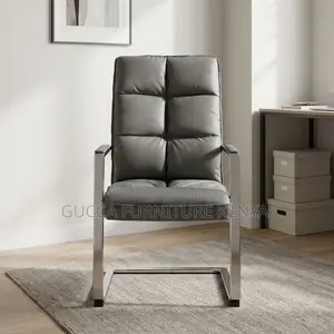Gray Leather Visitor's Chair With Armrest.