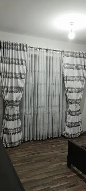 Brown and White Curtains With Rings