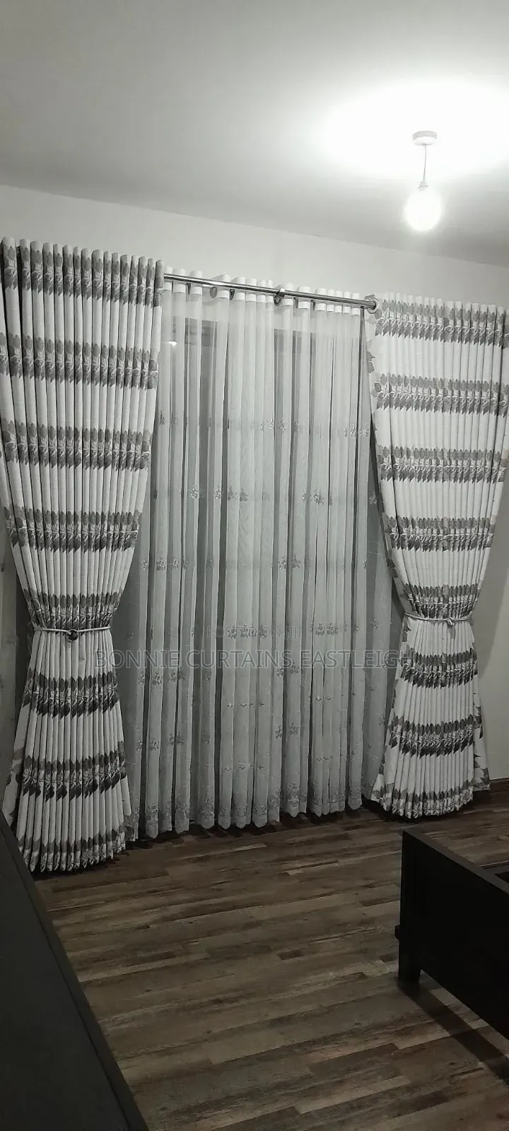 Brown and White Curtains With Rings