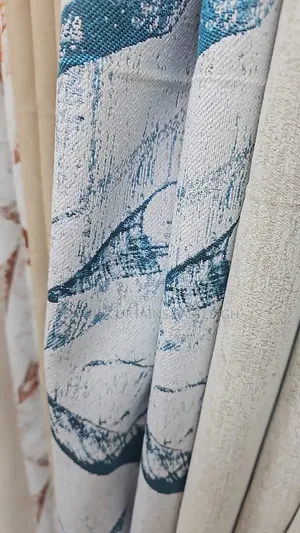Brown and White Curtains With Rings